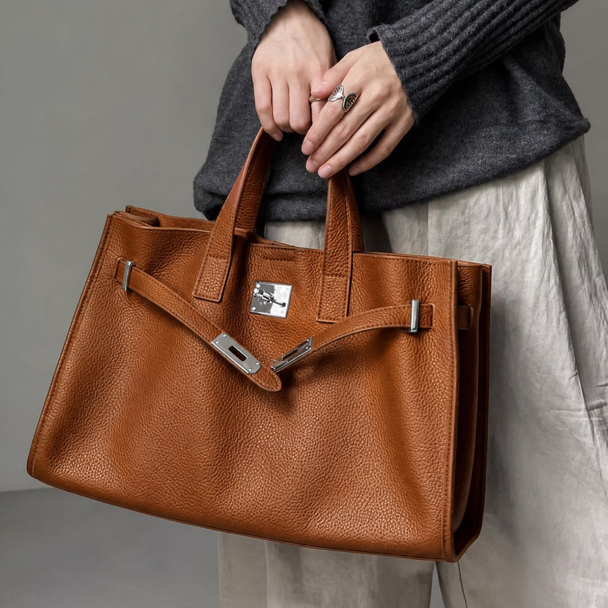 Meridian held by its top handles.